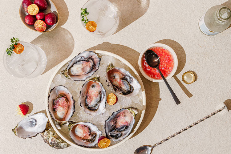 Gin-spired Bites: Oysters with Finger Lime and Ginger Mignonette